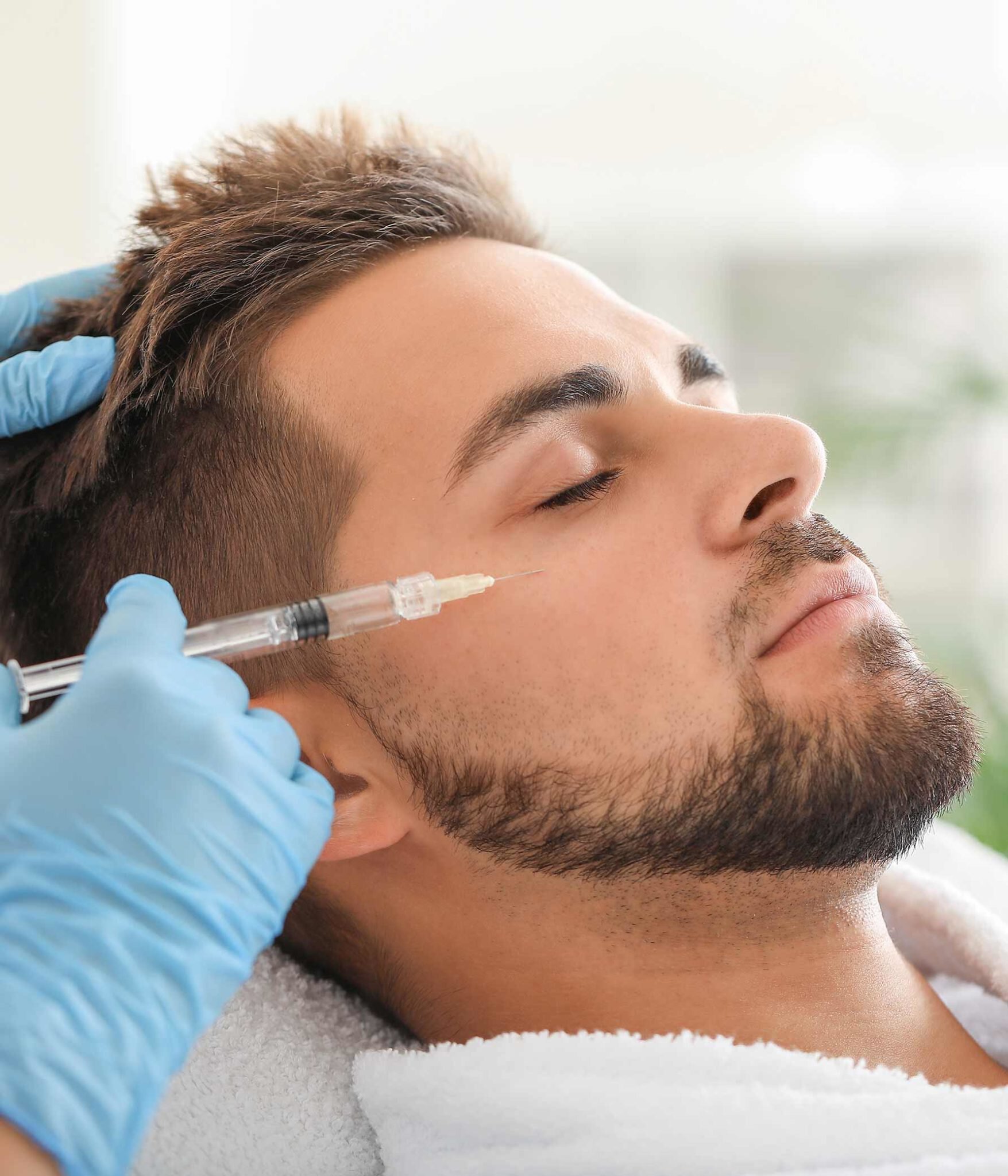 Austin Non-Surgical Cosmetic Treatments male model receiving treatment